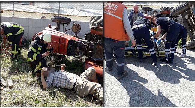 Devrilen traktörün altında kalan sürücüyü itfaiye kurtardı