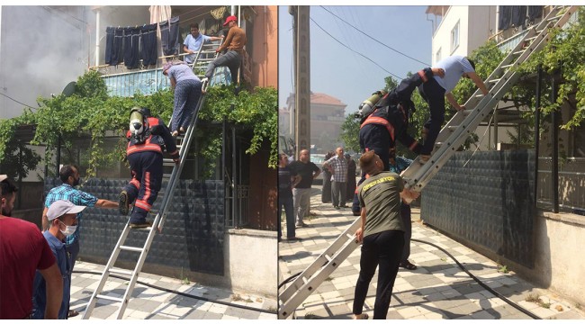 Yangında balkonda mahsur kalan 2 kişi itfaiye merdiveniyle kurtarıldı