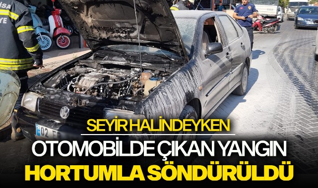 Seyir halindeki otomobilinde çıkan yangını hortumla söndürdü