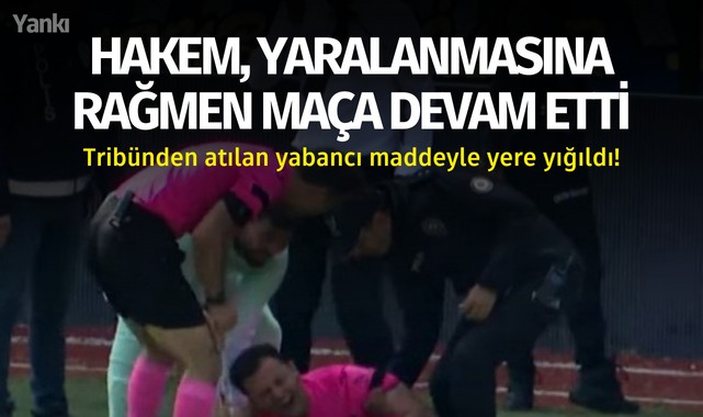 Hakem, yaralanmasına rağmen maça devam etti.. Tribünden yabancı madde atıldı!