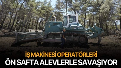 İş makinesi operatörleri yangına karşı ön safta alevlerle savaşıyor