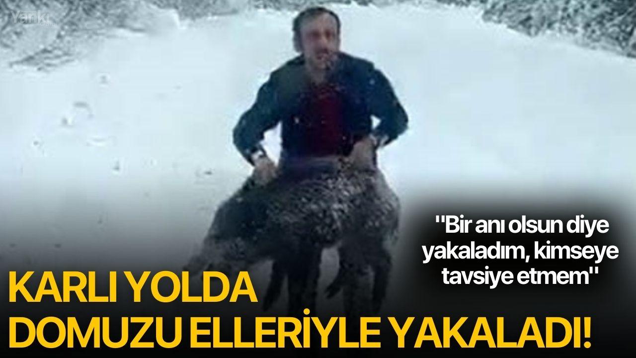 Karlı yolda domuzu elleriyle yakaladı!
